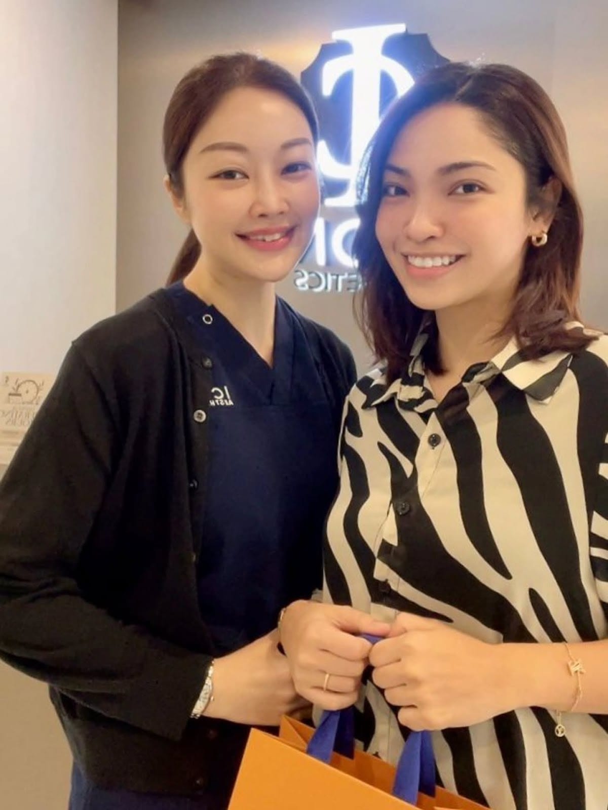 Certified aesthetician performing personalized skin diagnostic at ICON Aesthetics